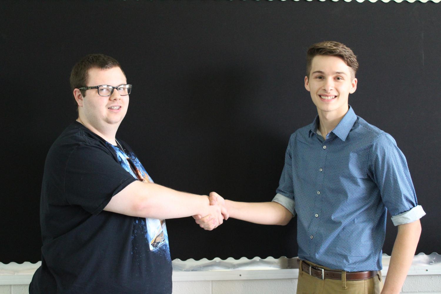 Austin Routt and Cole Bullock, seniors, shake hands respectfully after being voted President and Vice President of SODA club.