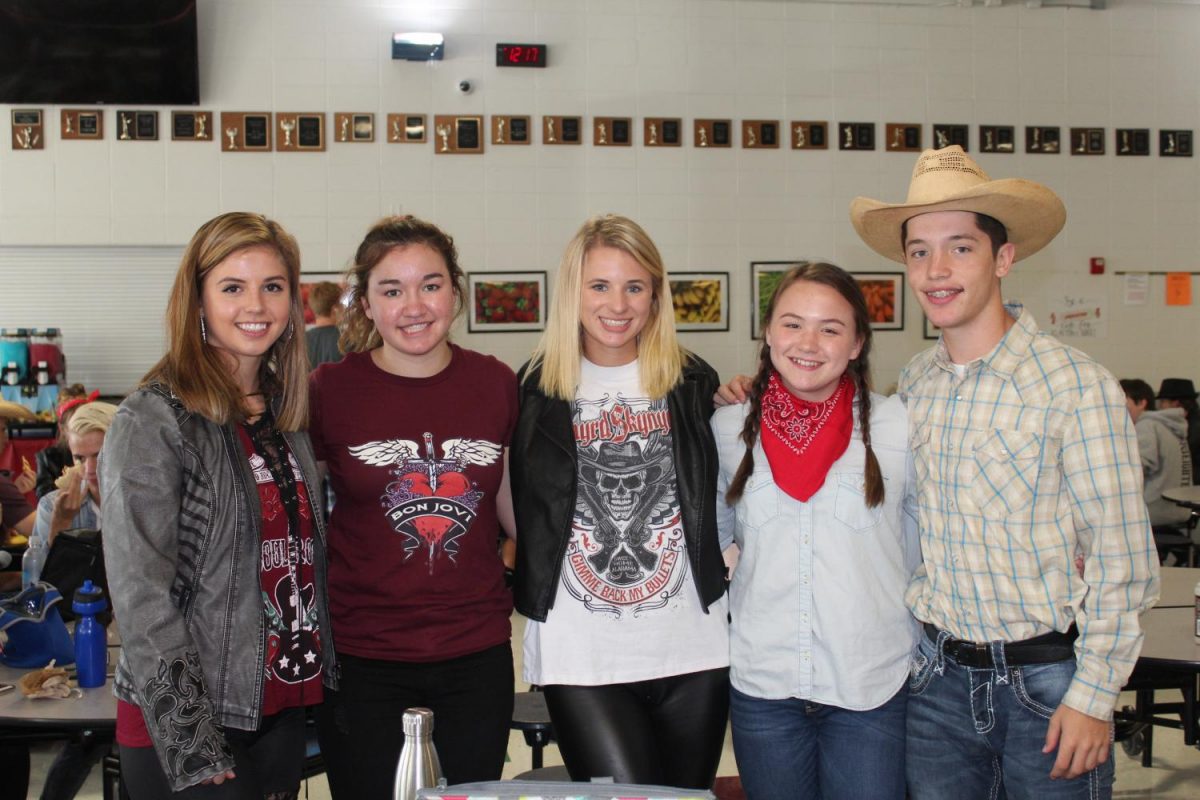 (Left to Right) Students Kennedy Deckard, Maddie Gardner, Mayci Huff, Payton Lafferty, and Kollin Bailey dressed in their best rapper, rocker, country outfits.
