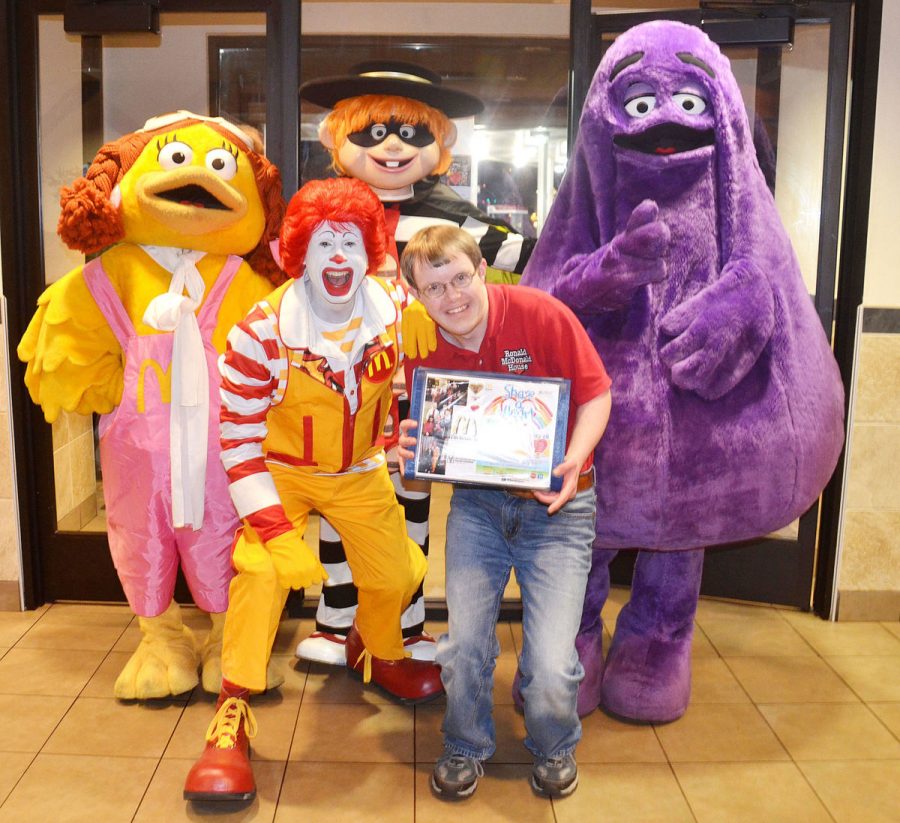 TJ Slocum posing with some of the McDonalds characters on a past McTJ Night.