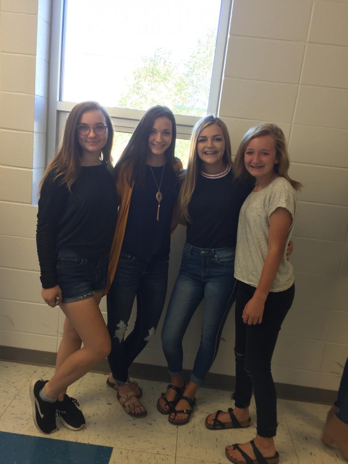 Freshman Lindsay Capps, Bria Marlin, Ellie Hartman, and Maddie Coltrane are all ready in line to get their picture taken.