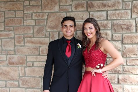 Student of the week Ricardo Aguimo(left) , stands with his prom date Alexis Moon (right), senior. 